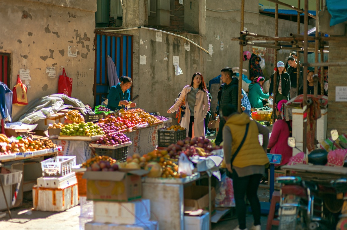Local Roman market with vendors and fresh produce